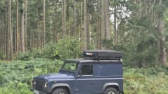 Landrover Defender Puma with Tentbox 