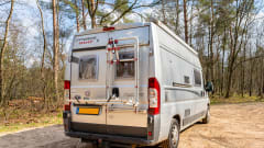 2 person bus camper with fixed bed and sanitary facilities