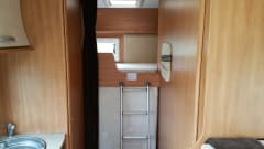Nice, complete family camper with large seating area