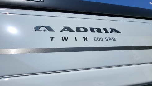 Adria Twin Sport 600 SPB – Chic, luxurious camper van with double bed, navigation system, bicycle rack 80 kg, etc.