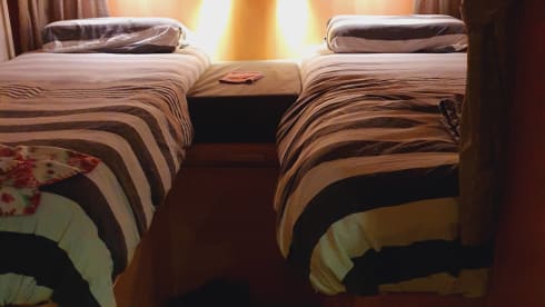 Comfortable camper with single beds and air conditioning