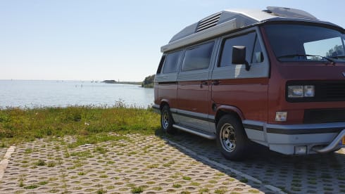 Original retro Volkswagen T3 Dehler with complete camping equipment.