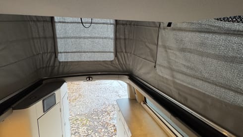 Nuggie – Fourgon aménagé Ford Nugget '25 bien conçu avec 4 couchages confortables