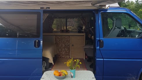 Cheerful Volkswagen camper van with lifting deck and pull-out bed for 2 people