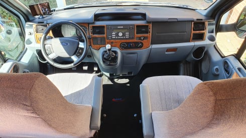 Comfortable camper with single beds and air conditioning