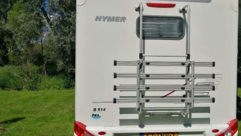 Wonderful luxury 4-person integral camper with plenty of storage space & bicycle carrier.