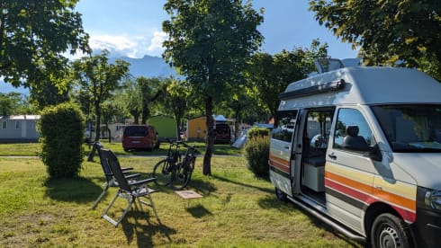 Retro Volkswagen Bus with bicycle carrier & awning