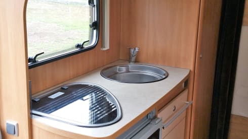 Nice, complete family camper with large seating area
