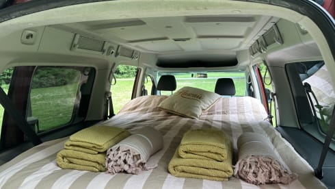 Super nice Volkswagen Caddy Maxi campervan from 2011 with tent, 4p