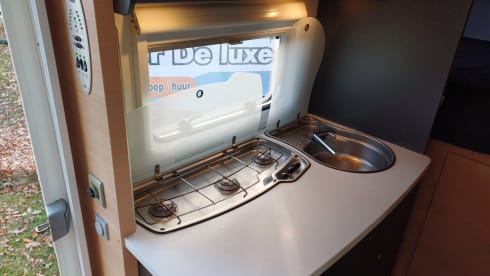  Beautiful compact Knaus camper with garage and large transverse bed!