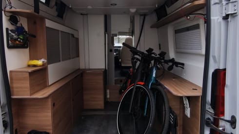 Off-grid campervan with lift-up bed, large garage 2024