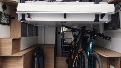 Off-grid campervan with lift-up bed, large garage 2024