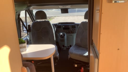 Semi-integrated camper