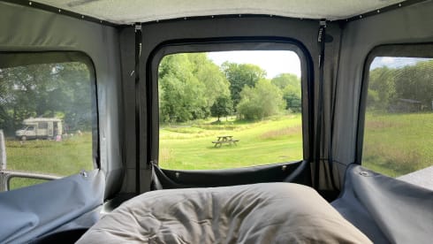 Guus (dan denk je aan brabant) – Red and white Volkswagen T5