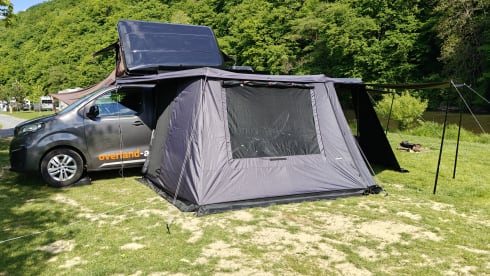 The AdventuresVan β Off-grid custom-made campervan with roof tent