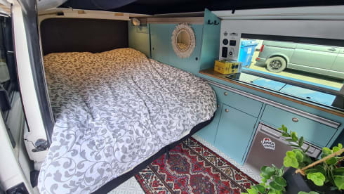 cool and cozy off grid camper van with lifting roof.