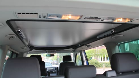 powerful VW T5 Multivan camper van with spacious Reimo pop-up roof