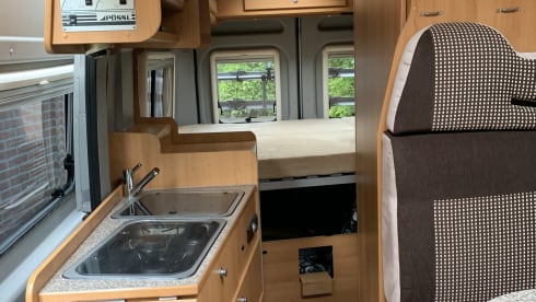 Compact Pössl 2Win factory-built bus camper (dog allowed)