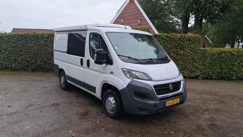 Peugeot boxer with fixed bed and large lifting roof
