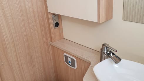 luxury camper including queen-size bed, pull-down bed and large garage and tow bar