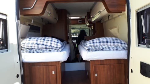 Bus camper with 2 length beds. Automatic 150 hp.