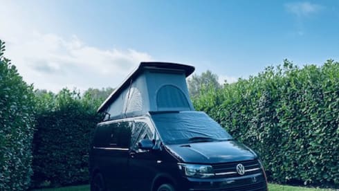 Biscy – 4 berth VW Campervan (Gas stove, 2 double beds, & gated car storage)