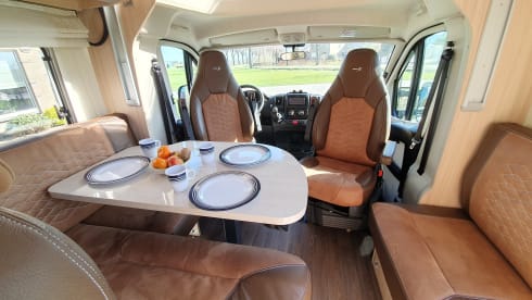 luxury camper including queen-size bed, pull-down bed and large garage and tow bar