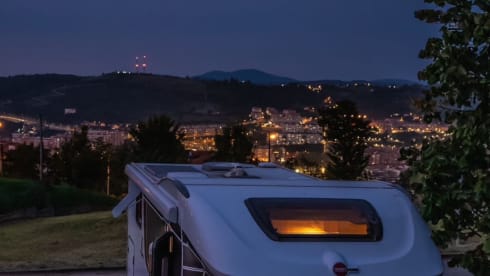 luxury camper including queen-size bed, pull-down bed and large garage and tow bar