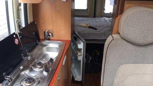 2 person bus camper with fixed bed and sanitary facilities