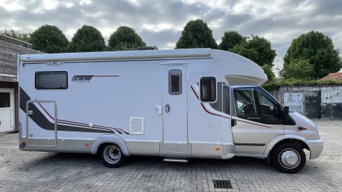 4p LMC semi-integrated with awning, air conditioning and cruise control.