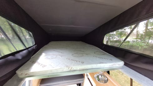 4-person Volkswagen with pop-up roof and long wheelbase for extra space