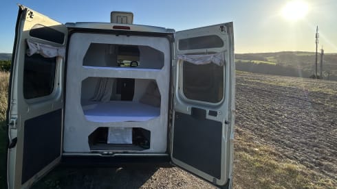 FOUR PEOPLE – Camper with two sleeping cabins for four people. 25% discount available.