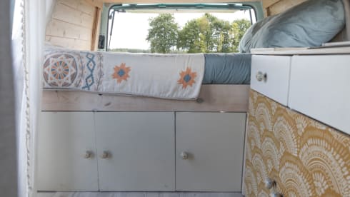 Retro turquoise camper, ready for a road trip. 
