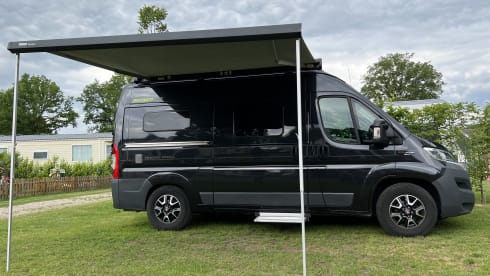 Super cool Hymer Ayers Rock bus camper for 2 people