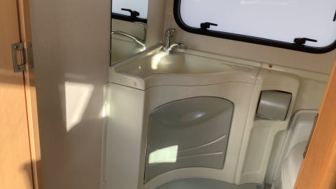 Semi-integrated camper