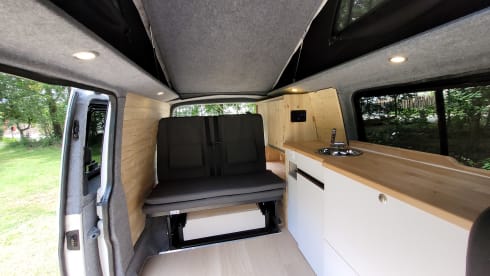 4-person Volkswagen with pop-up roof and long wheelbase for extra space
