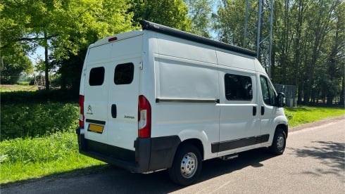 Trendy 2-person camper with solar panels