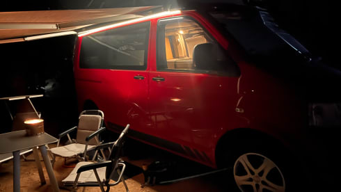 Red Volkswagen bus California T5