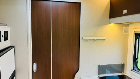 Koosje – Luxury Camper (5 persons) Lengthwise and lifting bed L-seat