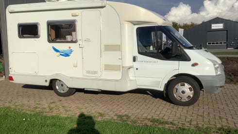 Semi-integrated camper