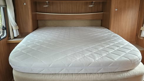 Comfortable motorhome with queen bed and electric bicycle carrier 