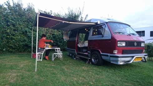 Original retro Volkswagen T3 Dehler with complete camping equipment.