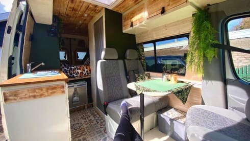 Home is where we park it! – Cool, fresh, self-sufficient 4 person bus camper.