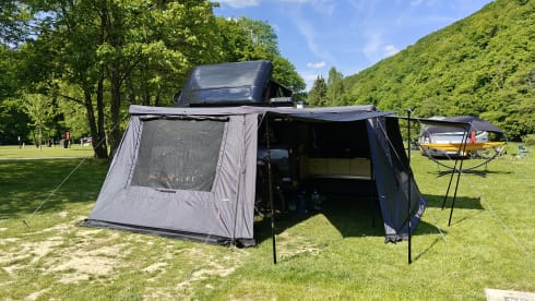 The AdventuresVan β Off-grid custom-made campervan with roof tent