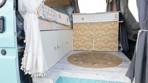 Retro turquoise camper, ready for a road trip. 