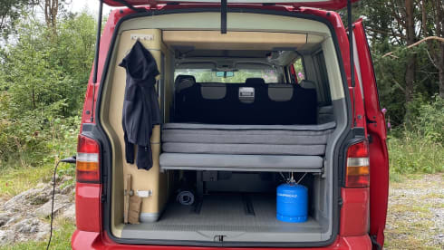 Red Volkswagen bus California T5