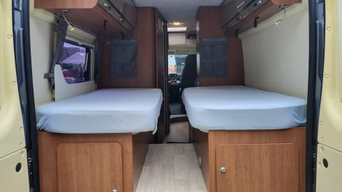 Neat camper van with length beds and solar panels