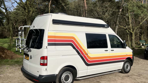 Retro Volkswagen Bus with bicycle carrier & awning