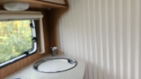 Comfortable motorhome with queen bed and electric bicycle carrier 