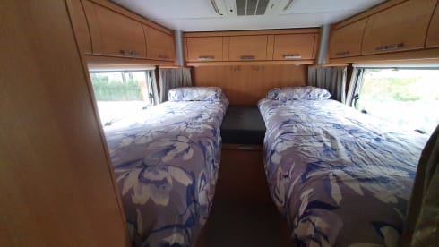 Comfortable camper with single beds and air conditioning